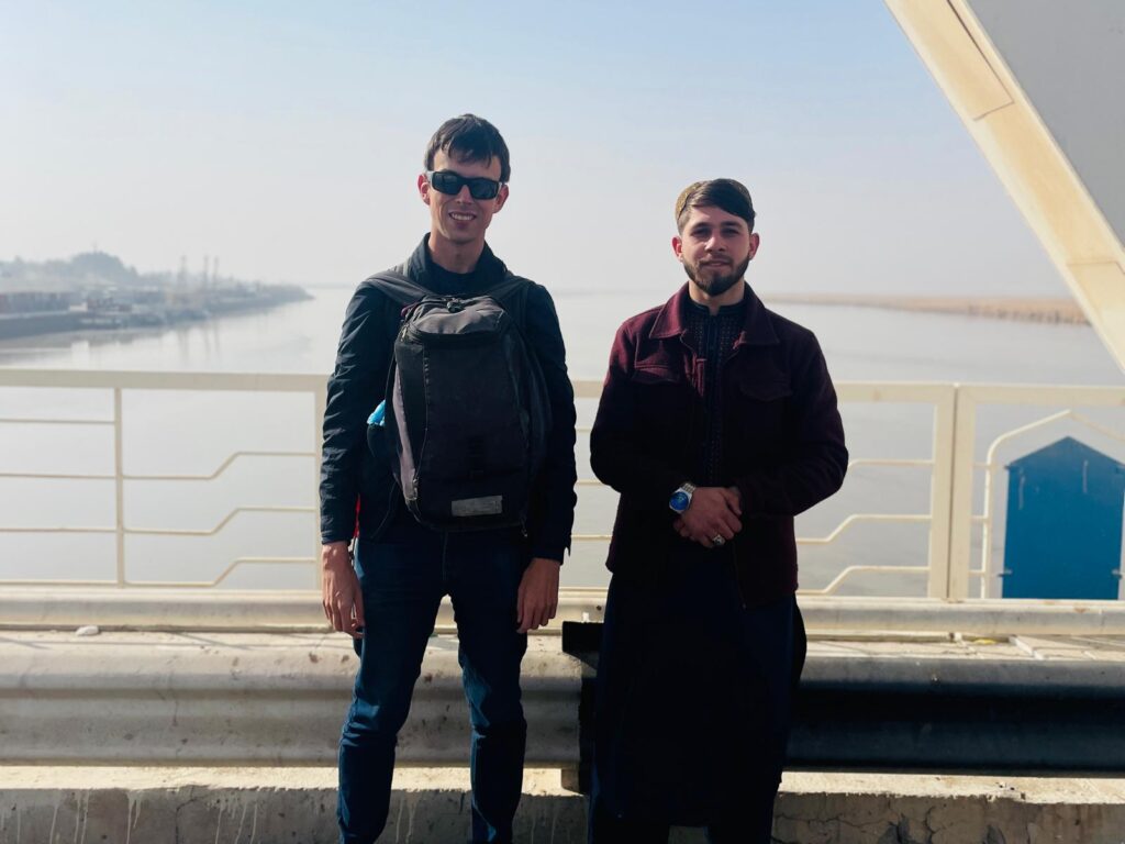 Alex with an Afghan man on the Friendship Bridge which connects Uzbekistan with Afghanistan at the Hairatan border.