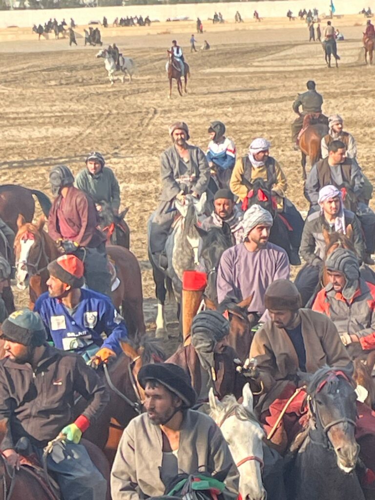 A group of Afghan men playing buzkashi in Mazar-i-Sharif.