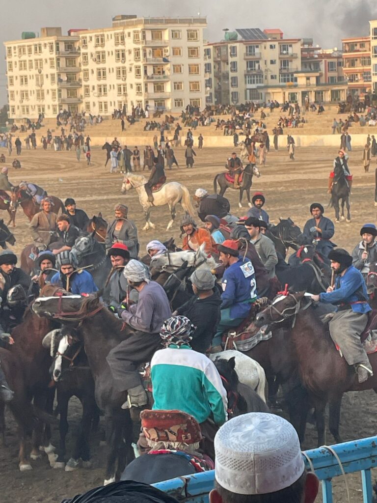 A group of men playing buzkashi on a Friday afternoon in Mazar-i-Sharif, Afghanistan.