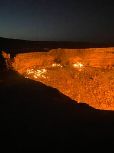 Fire burning at night inside Darvaza gas crater, known as the "Gates of Hell" in Turkmenistan's Karakum Desert.