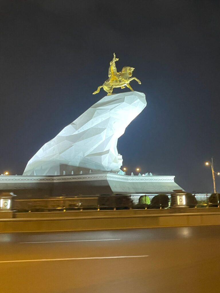 The golden "Arkadag" statue of former president Gurbanguly riding a horse in Ashgabat, Turkmenistan.