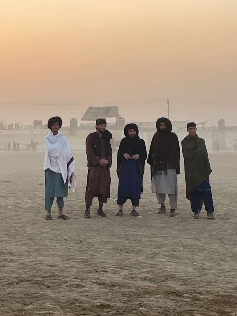 A group of Afghan men at the buzkashi in Mazar-i-Sharif.