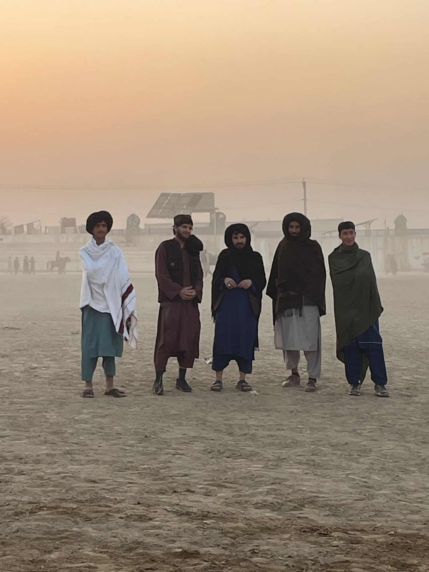 A group of Afghan men at the buzkashi in Mazar-i-Sharif.