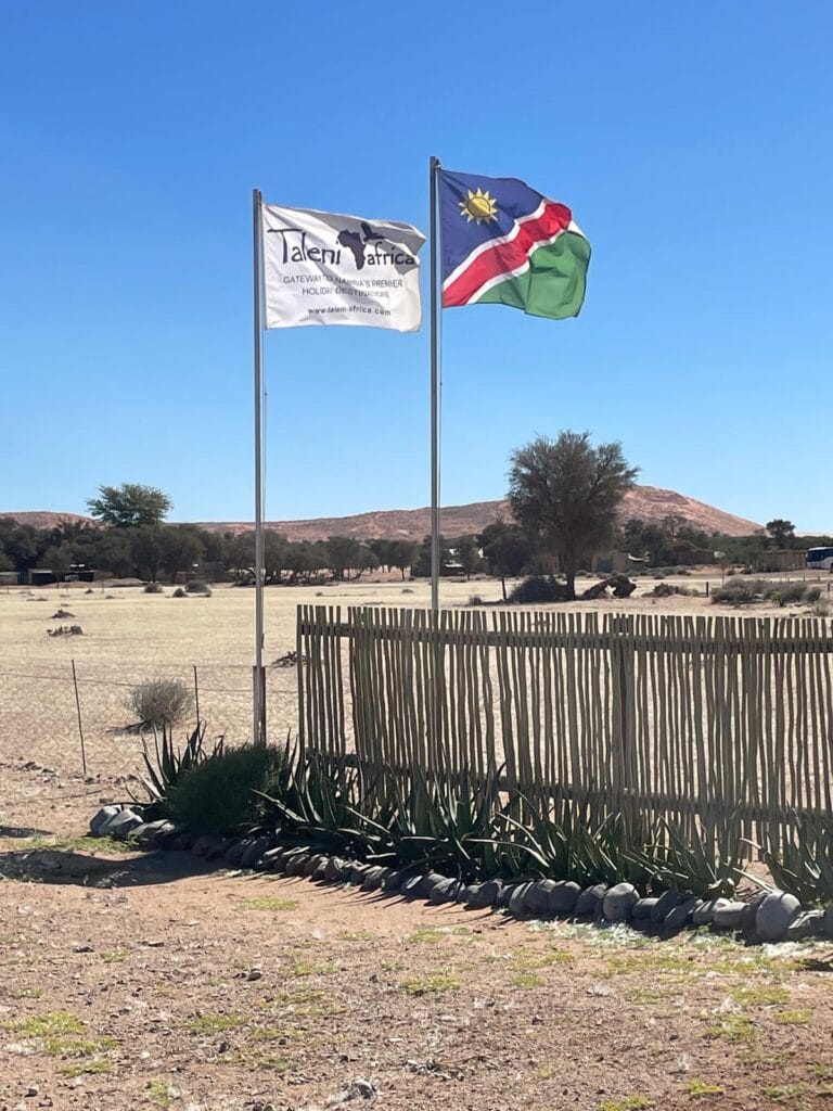 Two flags, including the Namibia flag on the right.