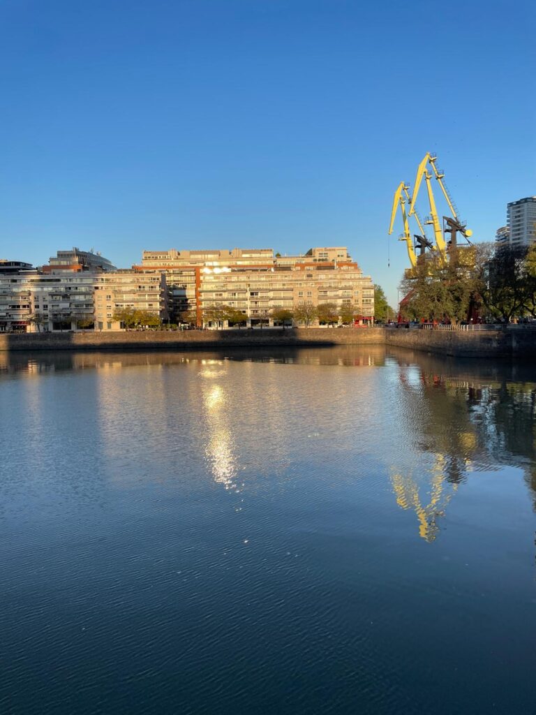 The waterfront at Puerto Madero in Buenos Aires, with buildings visible on the other side.