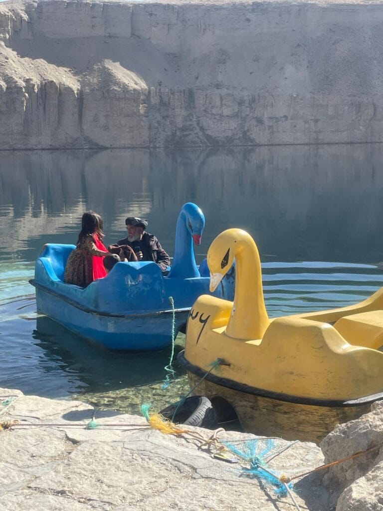 Swan-shaped boats in the water at Band-e-Amir National Park, Afghanistan.