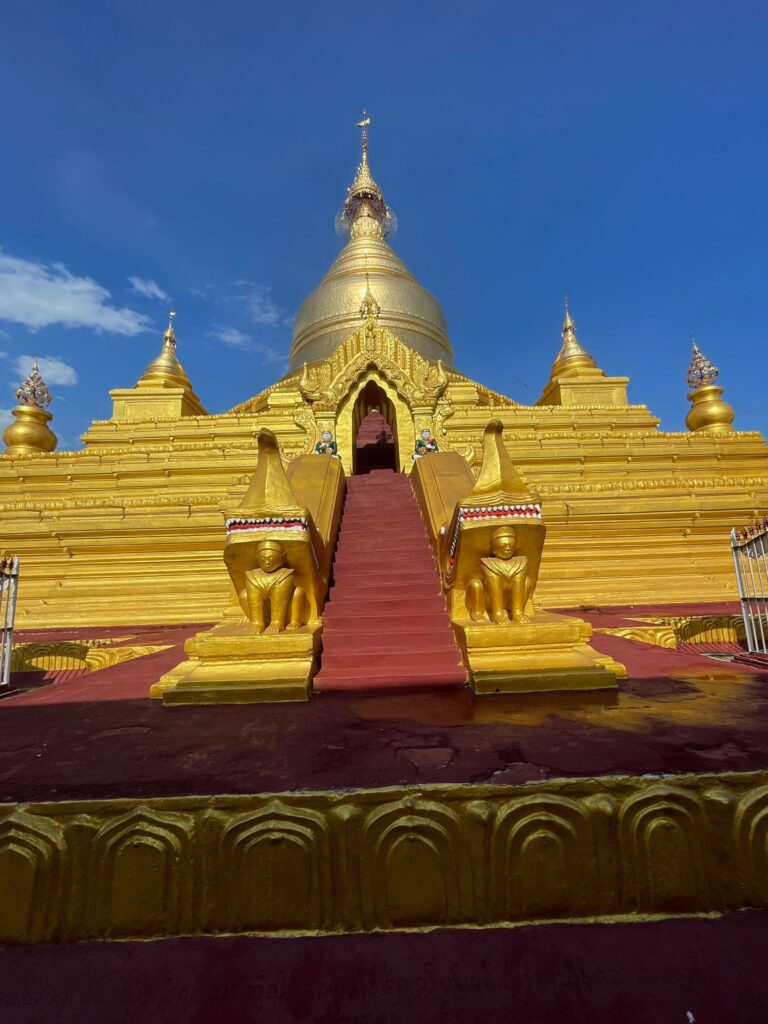 The golden stupa with red steps at Kuthodaw Pagoda in Mandalay, Myanmar
