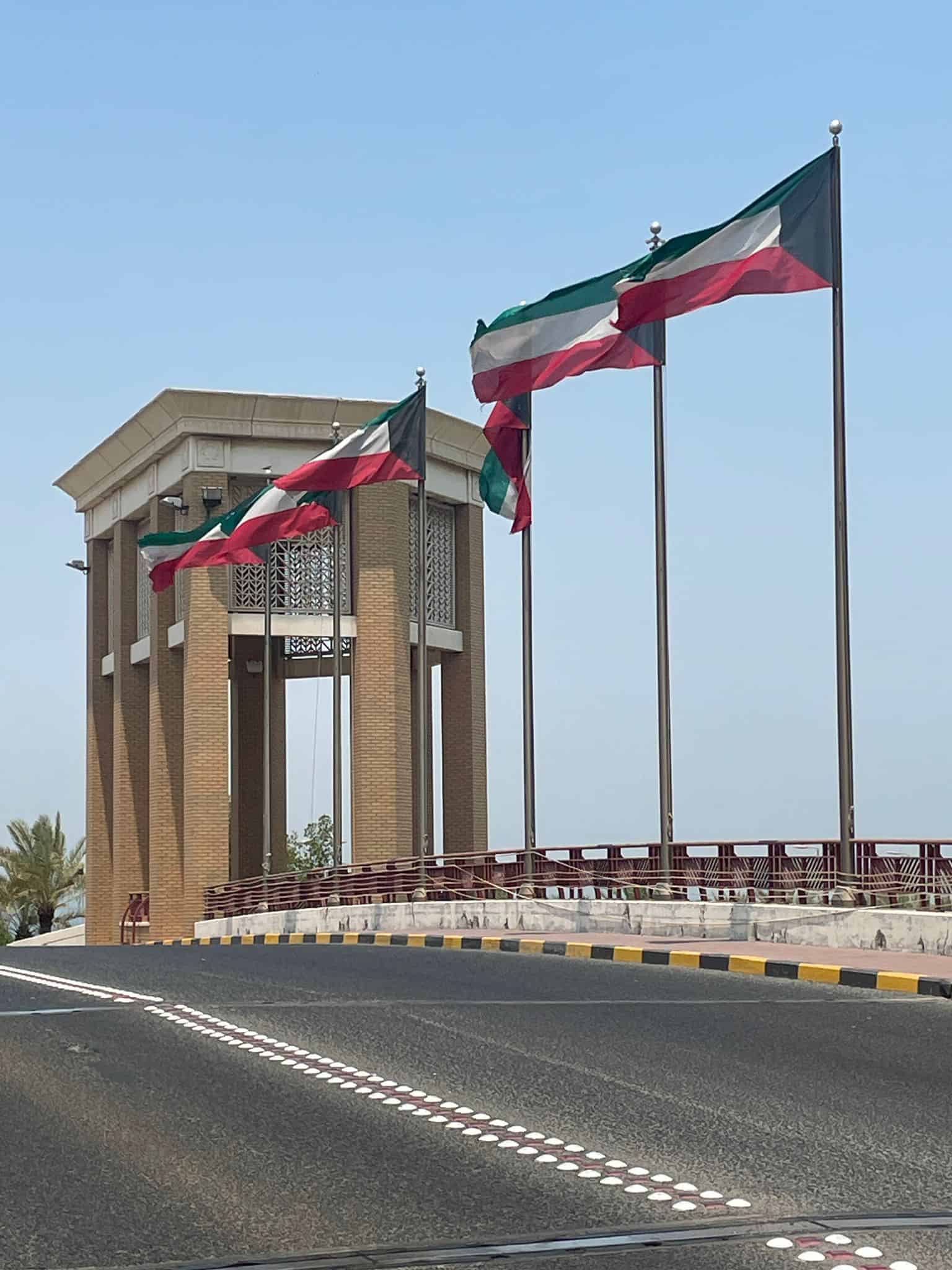 Kuwait flags on a bridge leading to Souq Sharq mall in Kuwait City, Kuwait
