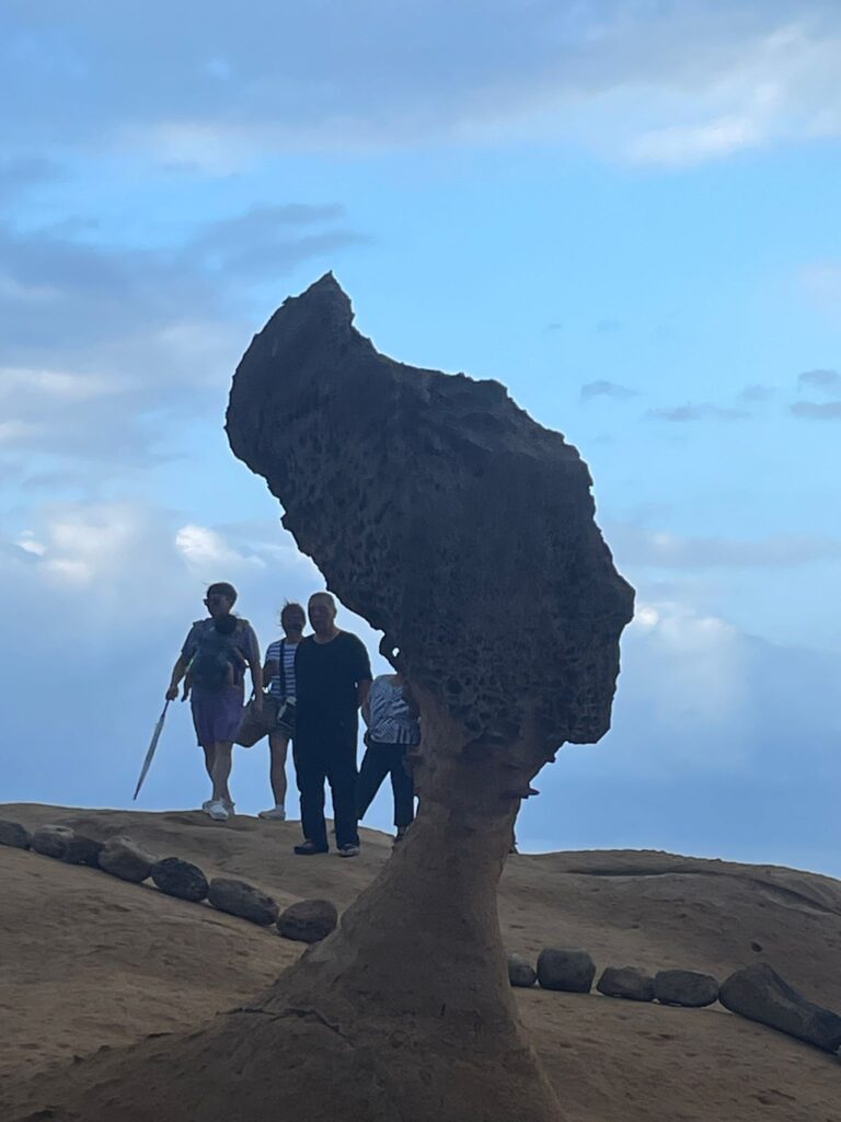 Yehliu Geopark photo with tourists in the background