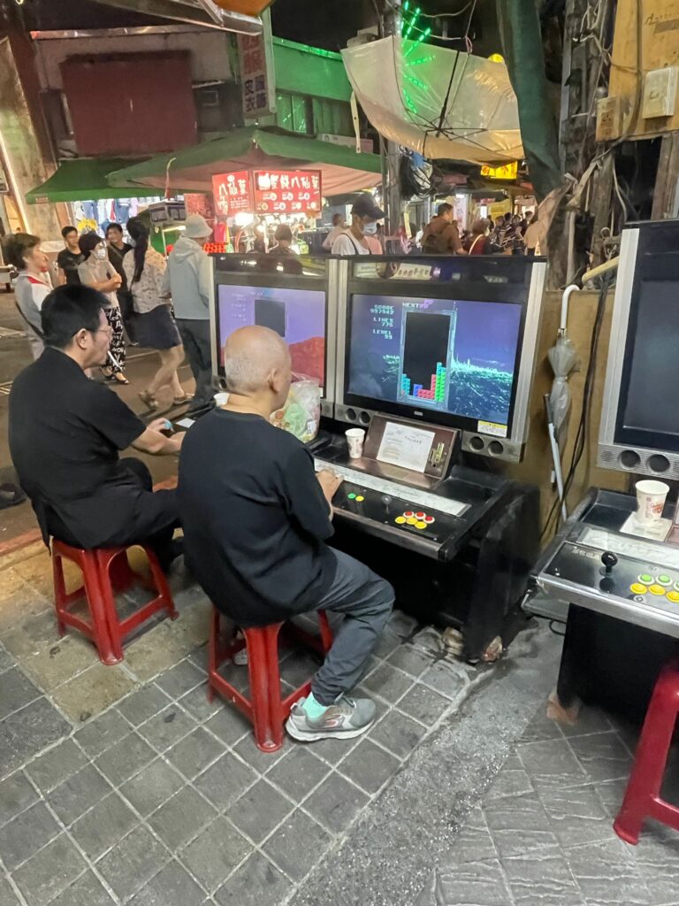 Two men playing Tetris in Taipei