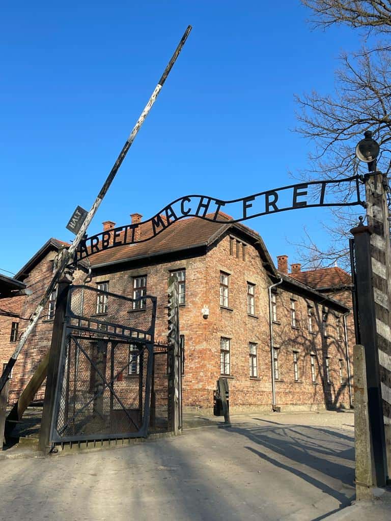 The entrance to Auschwitz concentration camp in Poland. The sign on the gate says "Arbeit Macht Frei" or "work sets you free" if you translate it to English