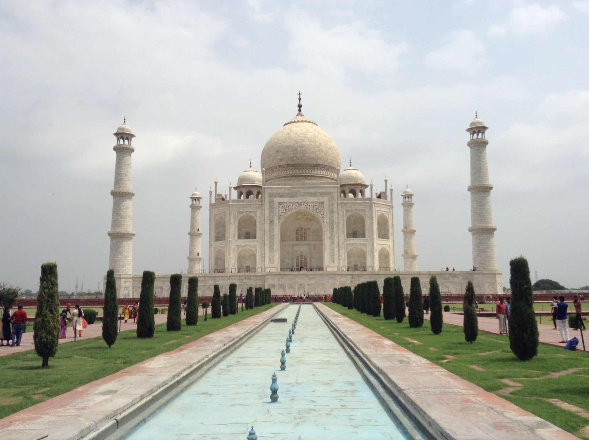 Central views of the Taj Mahal in Agra, India taken from one of the bridges over the stream that runs forward from the entrance.