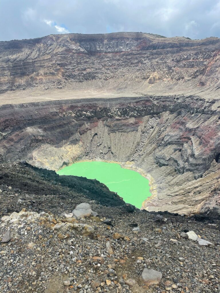 The crater of Santa Ana Volcano in El Salvador, which has a small lake with a greenish colour to it