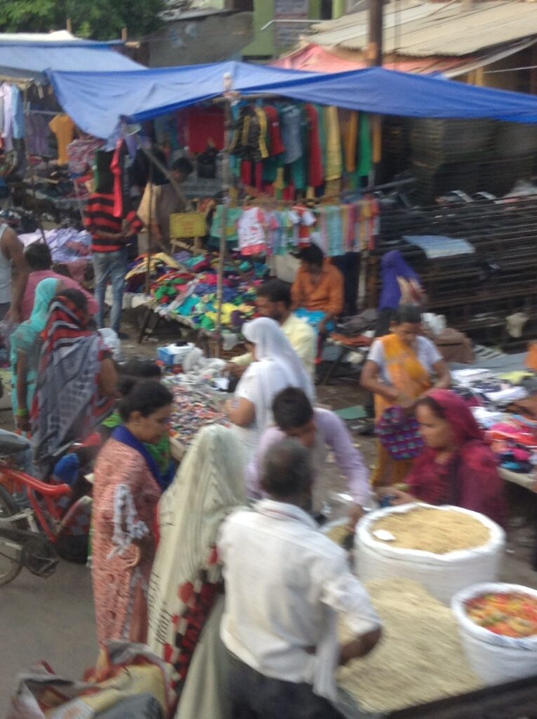 Locals at a food, spice and textiles market in India