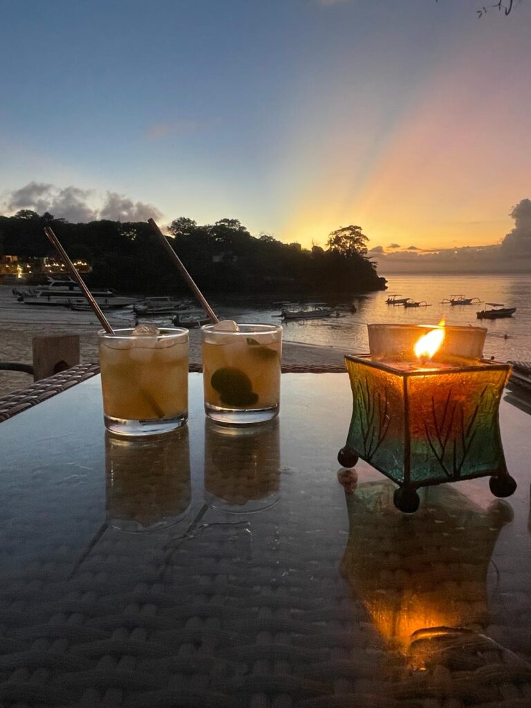 Is Nusa Lembongan worth visiting? Absolutely when you find yourself sipping cocktails such as these two on a candlelit table as the sun sets in the background
