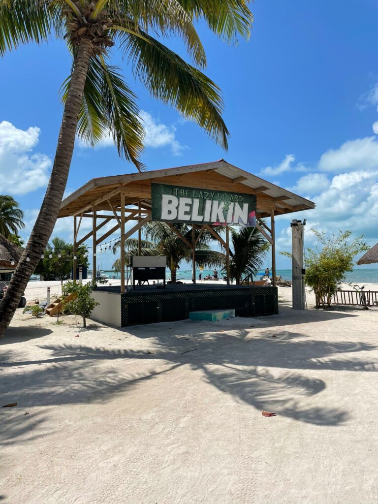 The Lazy Lizard bar on Caye Caulker, Belize. It has the word "Belikin" in large bold letters, which is the name of Belize's most popular beer brand