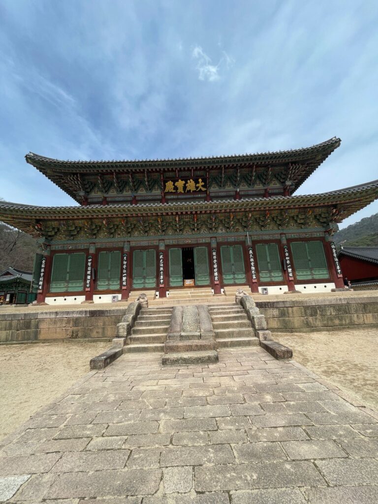 Daeungbojeon: The main hall at Beopjusa Temple. It has 8 brown pillars holding up two layers of roofing in the traditional Korean style
