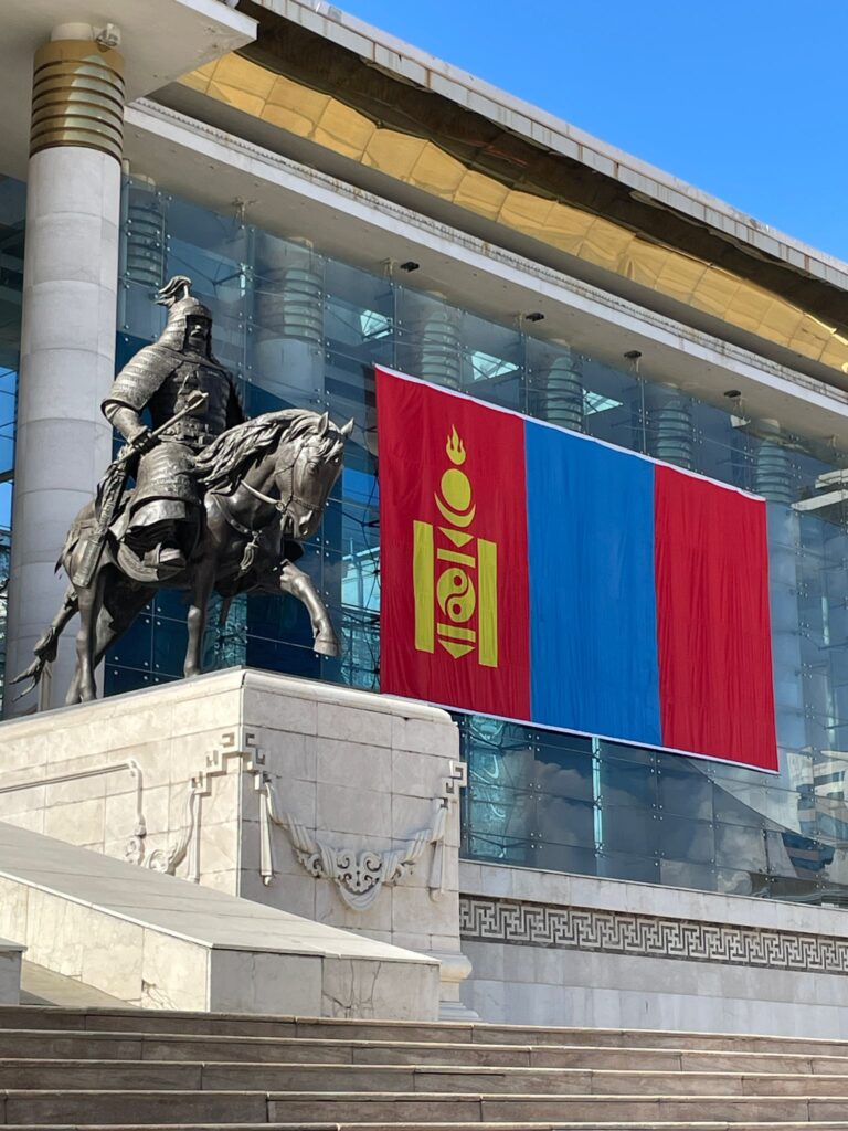 A large statue of Kublai Khan on horseback, alongside a giant Mongolian flag which was put up alongside a Belarusian flag on the opposite side (not pictured) to mark the state visit of Belarusian president Lukashenko
