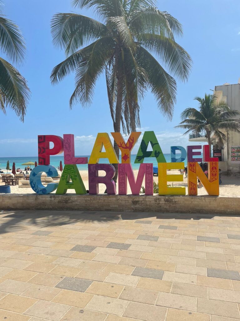 A colourful "Playa del Carmen" sign in the popular Mexican beach destination of the same name