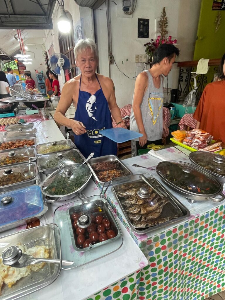 A man selling street food in the Philippines