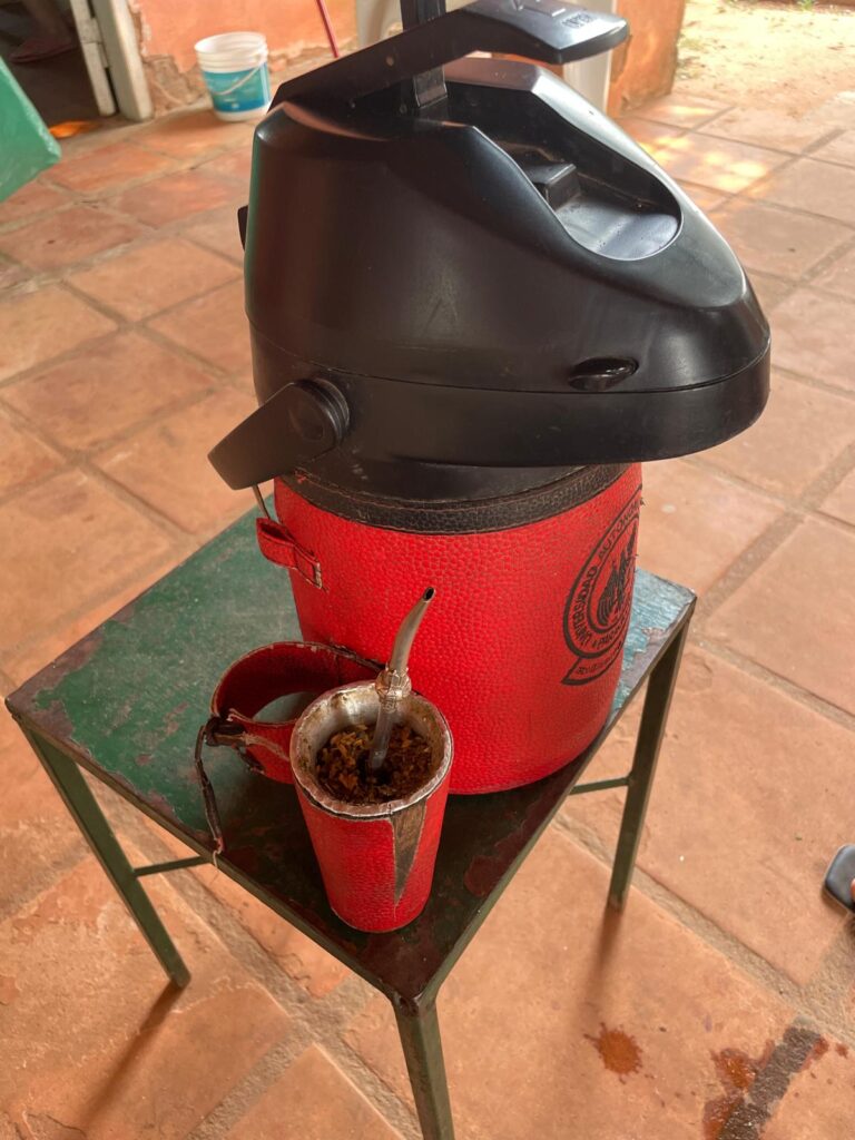 A Paraguayan gourd with the traditional drink terere, alongside a large flask