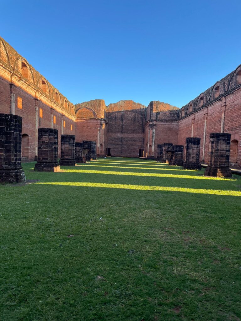 Pink walls with several small columns inside them at Paraguay's Jesuit mission of Jesus de Tavarangue