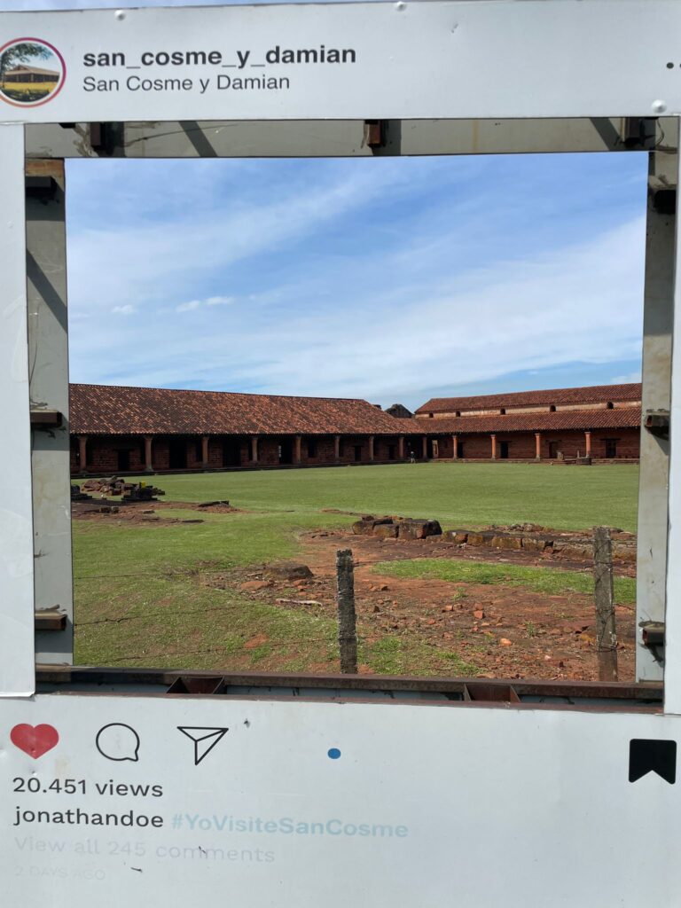 The Jesuit Missions of San Cosme y Damian, inside a frame which is made to look like an Instagram post, with "buttons" to like, comment or share the image, and a comment below which says "#YoVisiteSanCosme" (I visited San Cosme in Spanish)