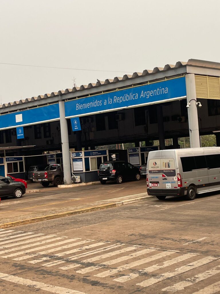 The entry point to Argentina at Puerto Iguazu. A series of vehicles queue up to enter the country from Brazil