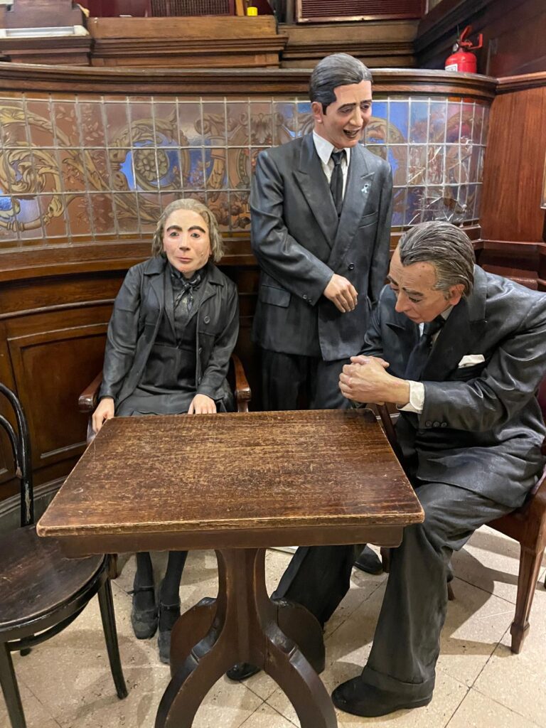 Statues of Argentinian cultural icons Alfonsina Storni (left), Carlos Gardel (centre) and Jorge Borges (right) at Cafe Tortoni in Buenos Aires