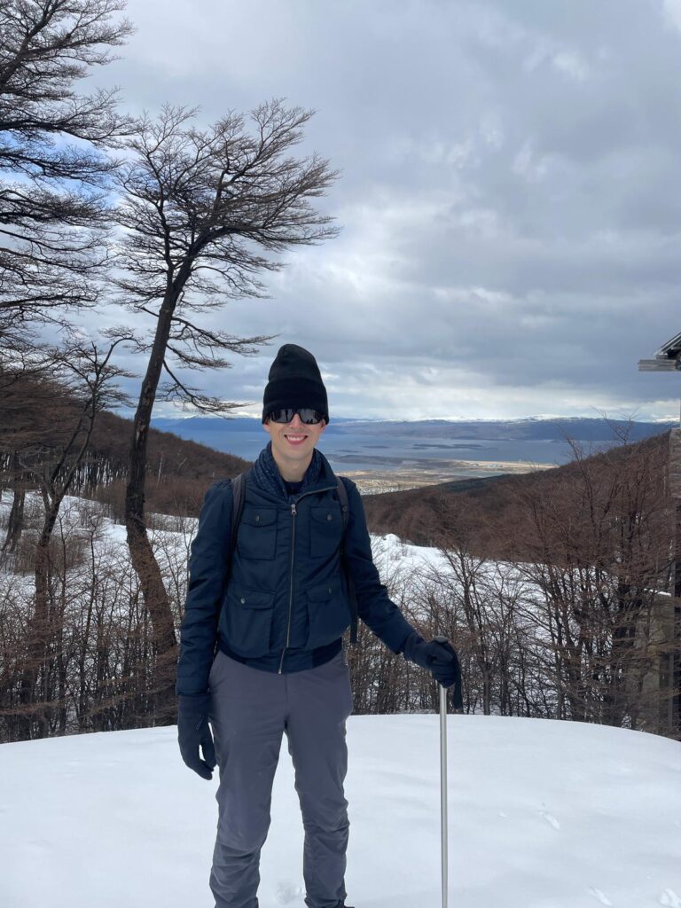 Myself in a coat, hat and gloves standing on snowy Martial Glacier near Ushuaia in Argentina