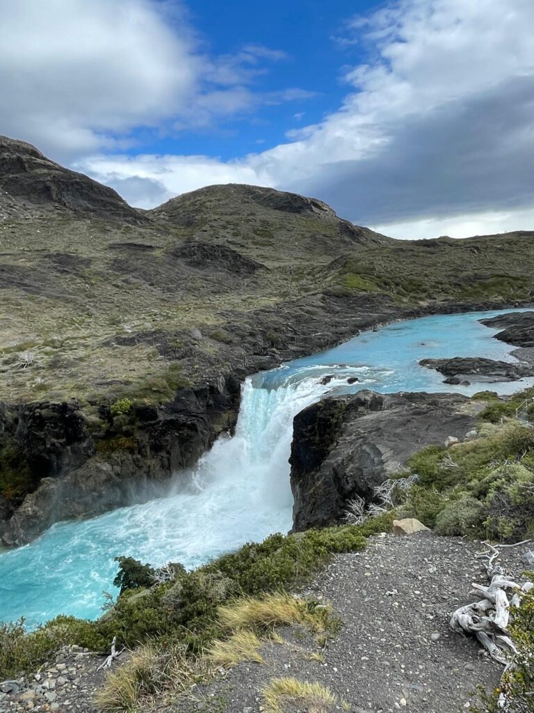 A bright blue waterfall in Torres del Paine National Park, Chilean Patagonia