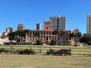 The president's palace (Palacio de los Lopez) in Asuncion, Paraguay, from behind. The Paraguay flag is waving from the top of the palace.