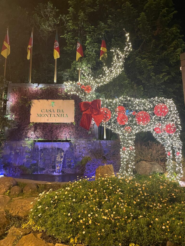 A reindeer made up of Christmas lights next to Casa da Montanha in Brazilian town Gramado