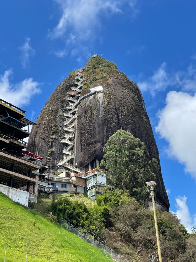 El Peñon de Guatape in Colombia, a large rock with zig-zagging staircases built into the middle. There are great lake views from the top