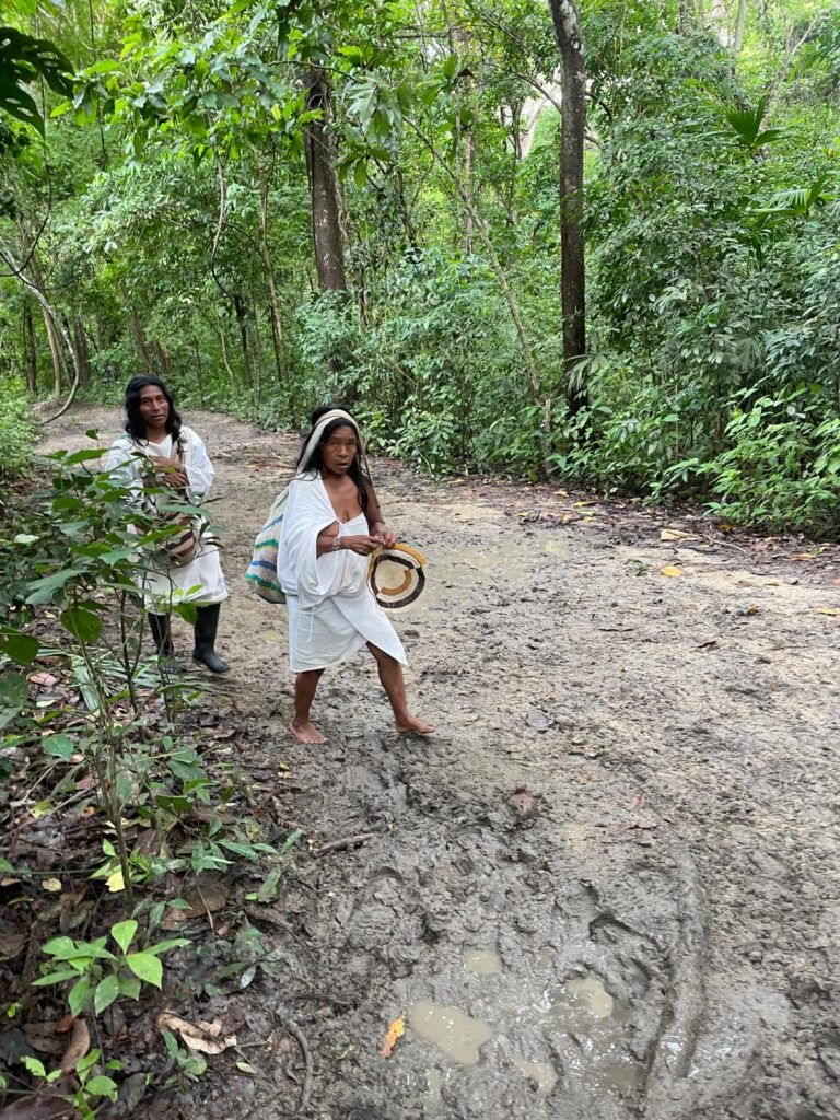 Two members of the indigenous Kogi Tribe in the jungles of Tayrona National Park, Colombia