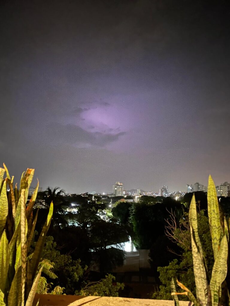 Purple skies during a thunderstorm over Santa Marta in Colombia at night