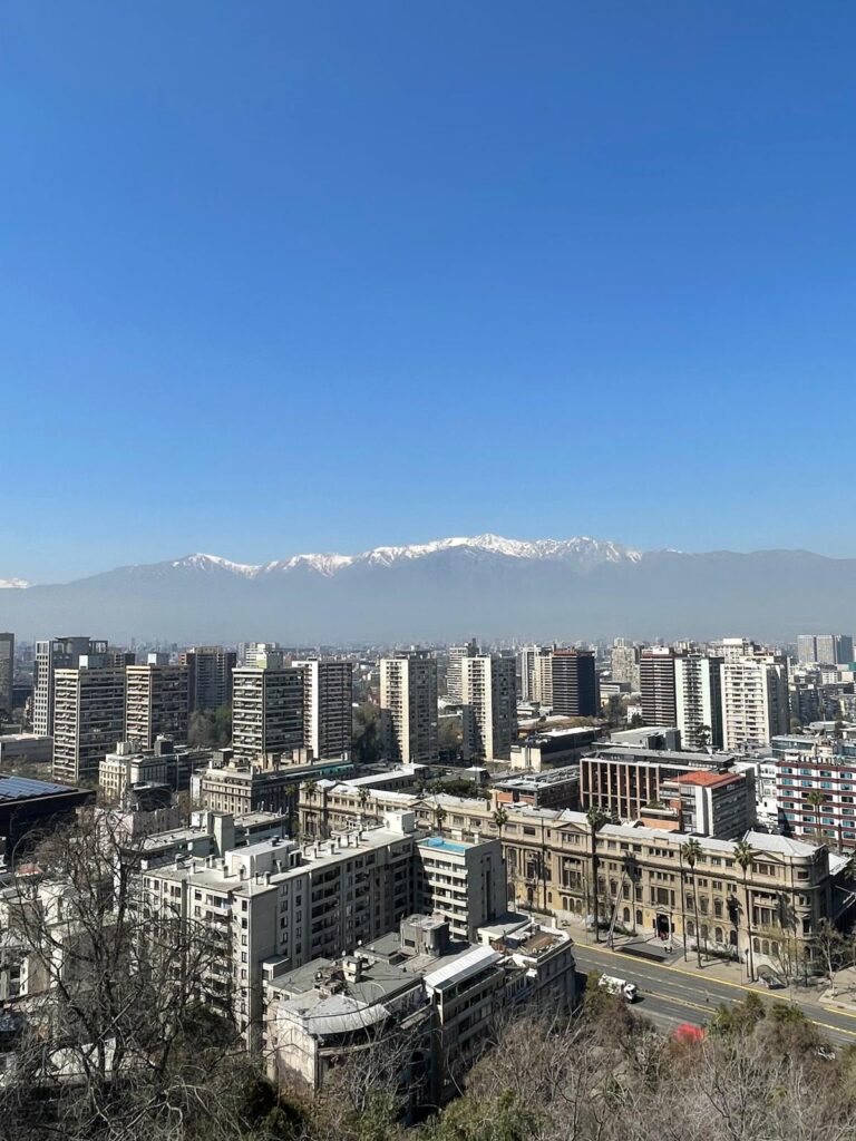 Skyscrapers in Santiago, Chile. As seen from the top of Cerro San Cristobal. There are also several snowy mountains visible in the background