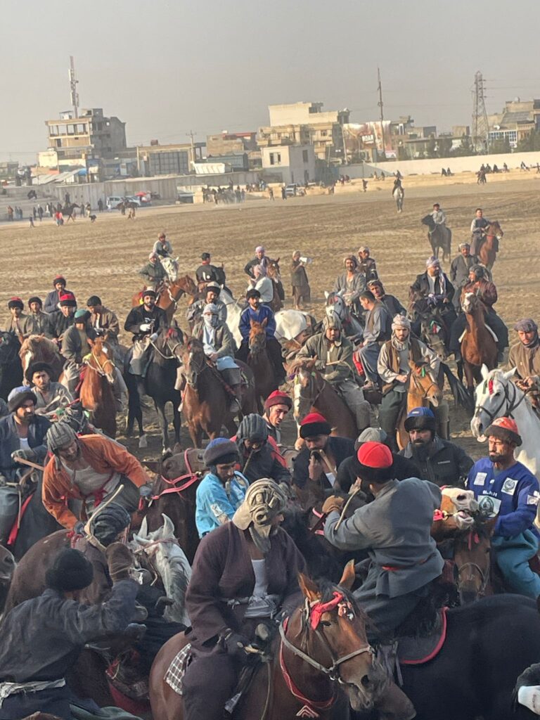 Players compete for possession of a sack during a buzkashi match in Mazar-i-Sharif, Afghanistan.
